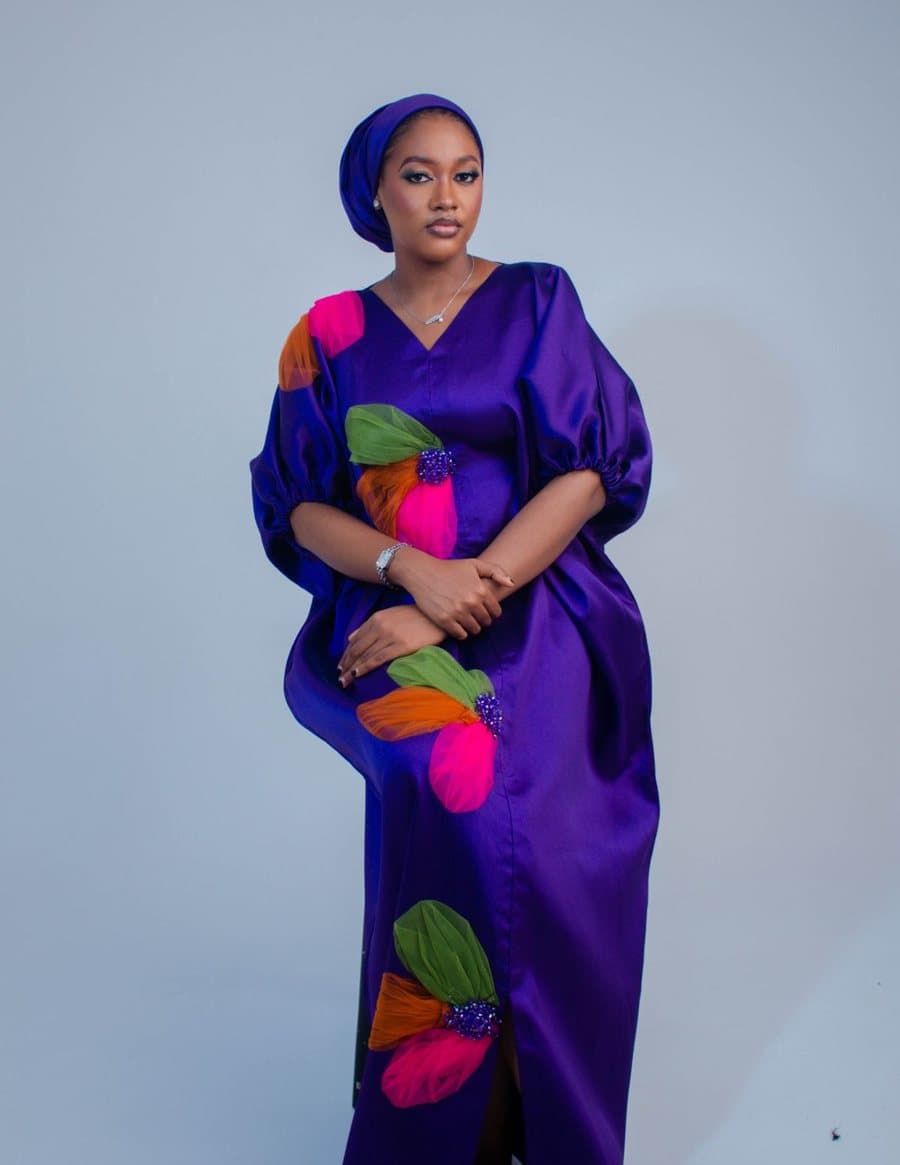 Inspiration photo, not our product: A purple kaftan with wide sleeves and bright leaf motifs