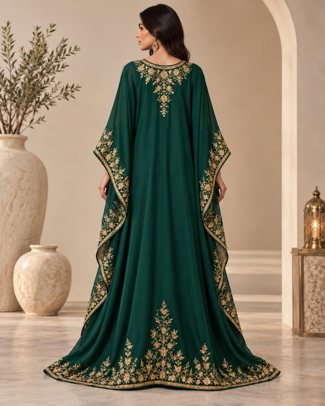 Back of the emerald kaftan, with gold vines across the back yoke and around the hem, design preview